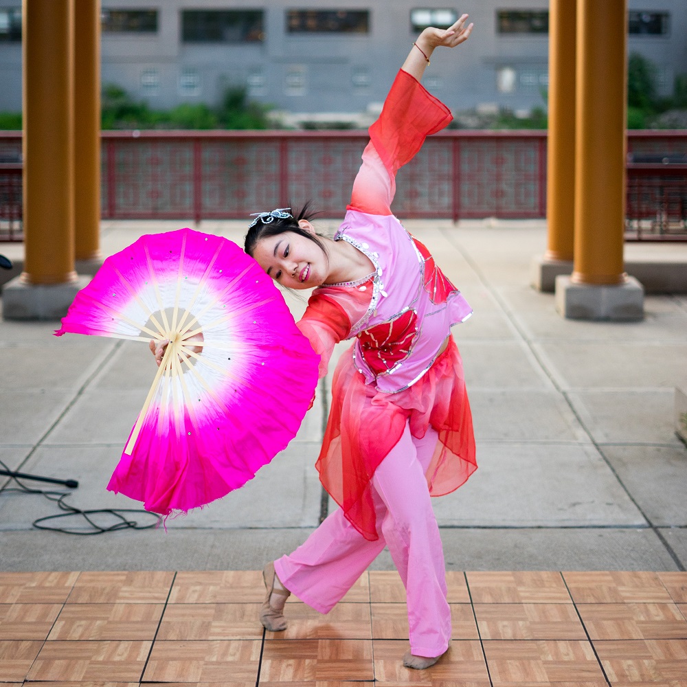 Woman dancing Chinese Fan Dance