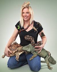 The Frog Lady with a snake, turtle, lizards and some frogs.