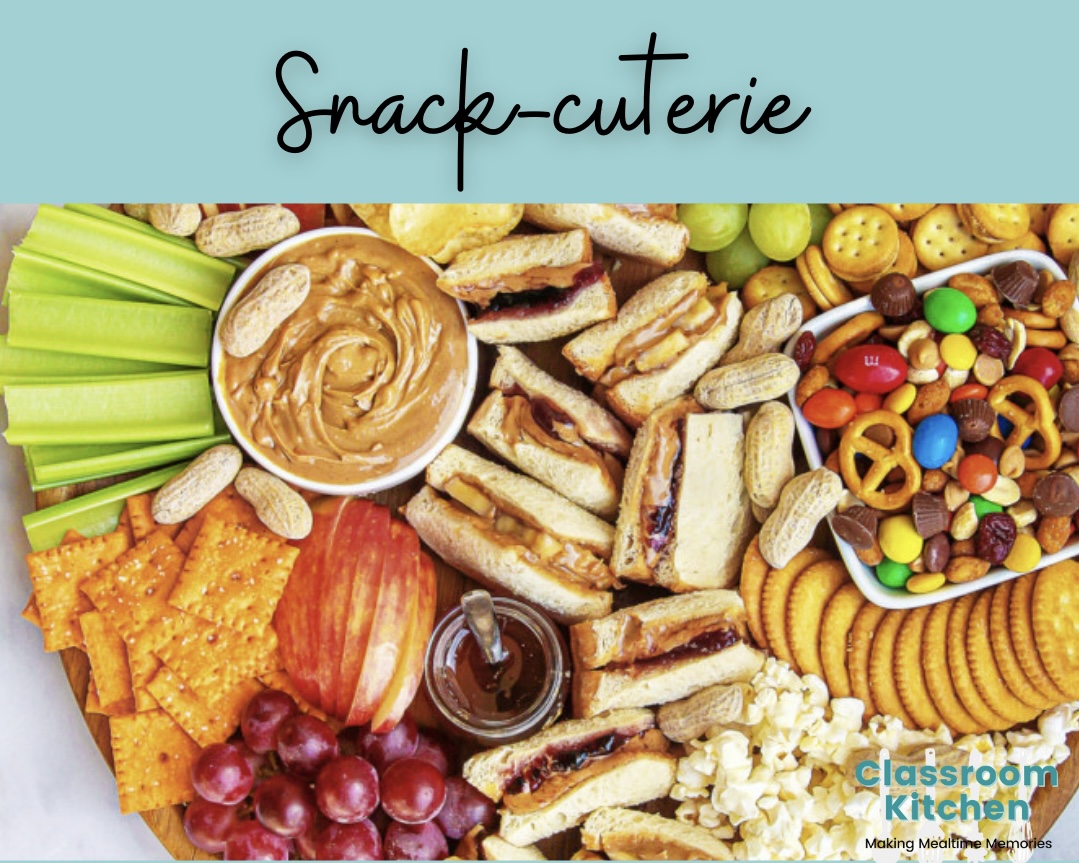 Tray filled with veggies & dip, crackers, fruit and candy