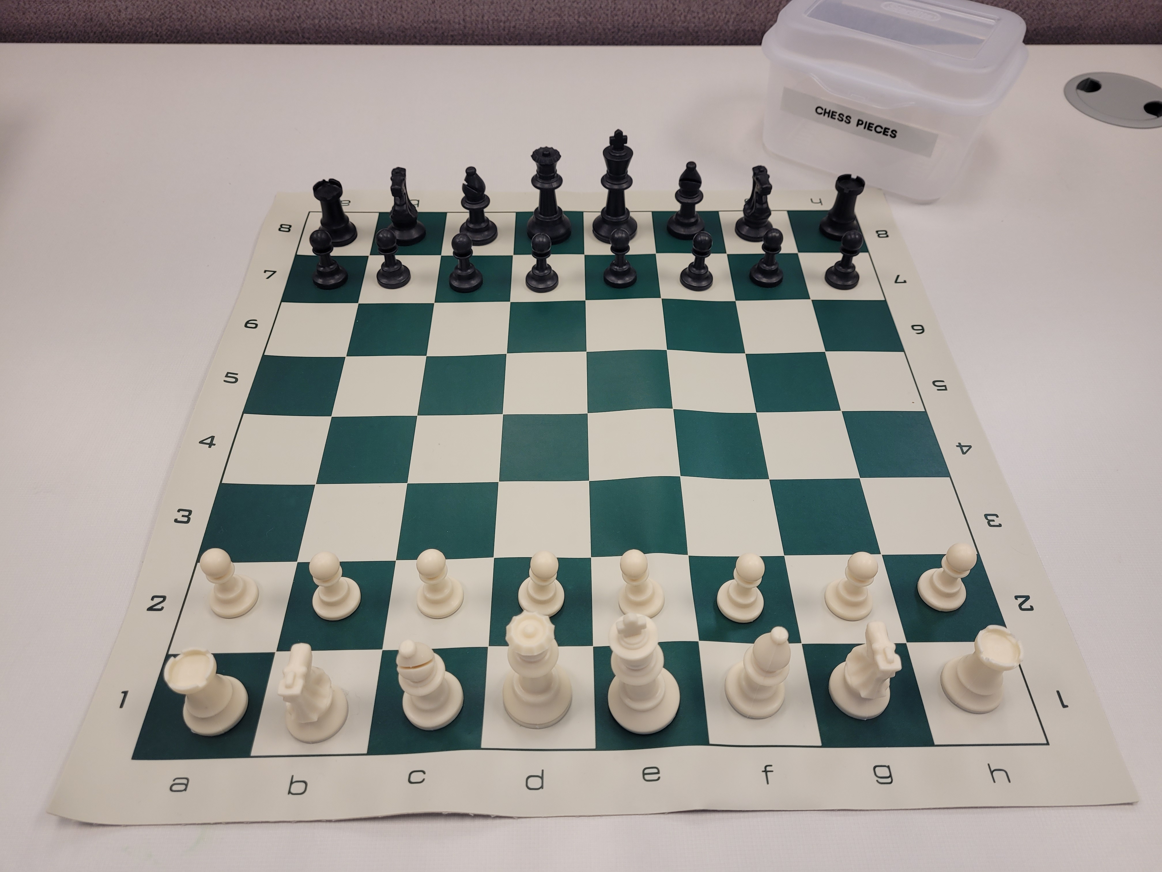 A chess board set up and ready to play