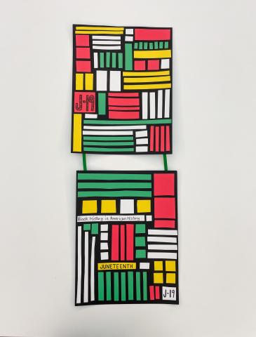 Juneteenth colored paper banner; two black squares with red, yellow, green & white stripes glued on top