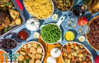 table top with green beans, potatoes, corn and other fall vegetables