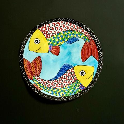 Circle painting of two rainbow fish