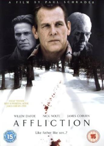 Film poster for Affliction.  Nick Nolte's face looming over a snowy woodwith blood 
