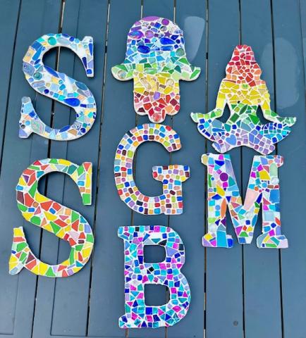 Letters covered in colorful ceramic tiles