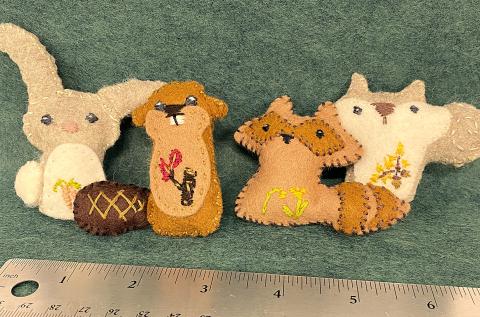 Four hand-sewn felt animals