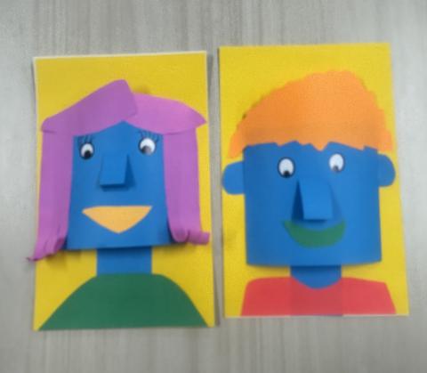 3D paper portrait with blue faces and purple and orange hair