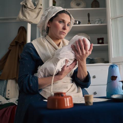 Rachel Revere holds her baby