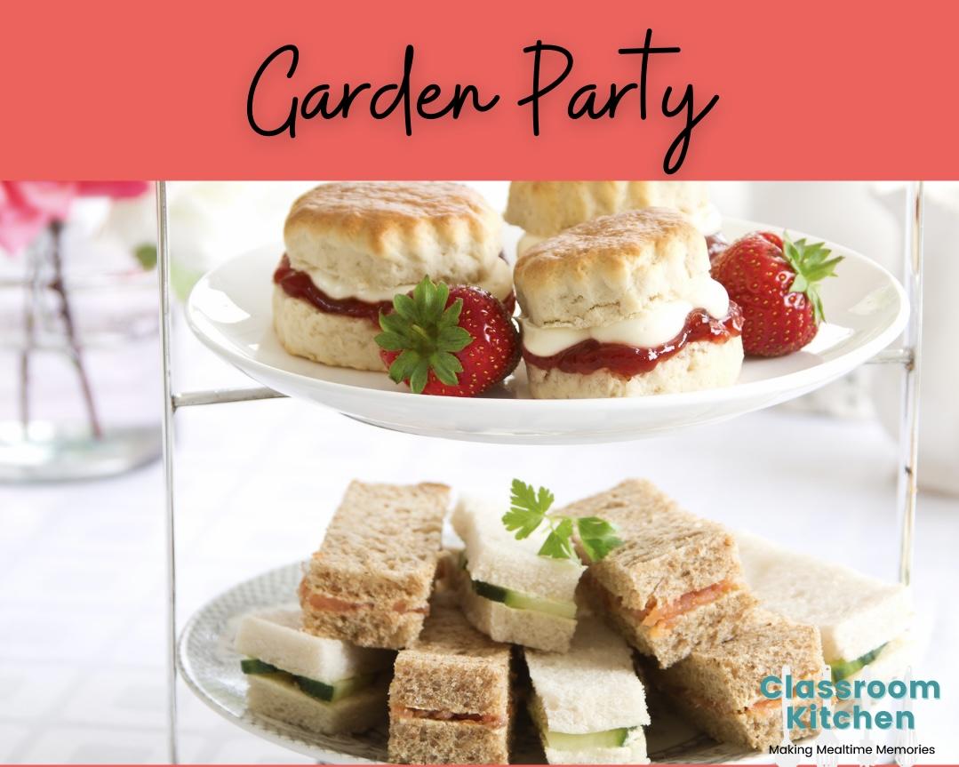 Tray with strawberry shortcakes with cream and finger sandwiches