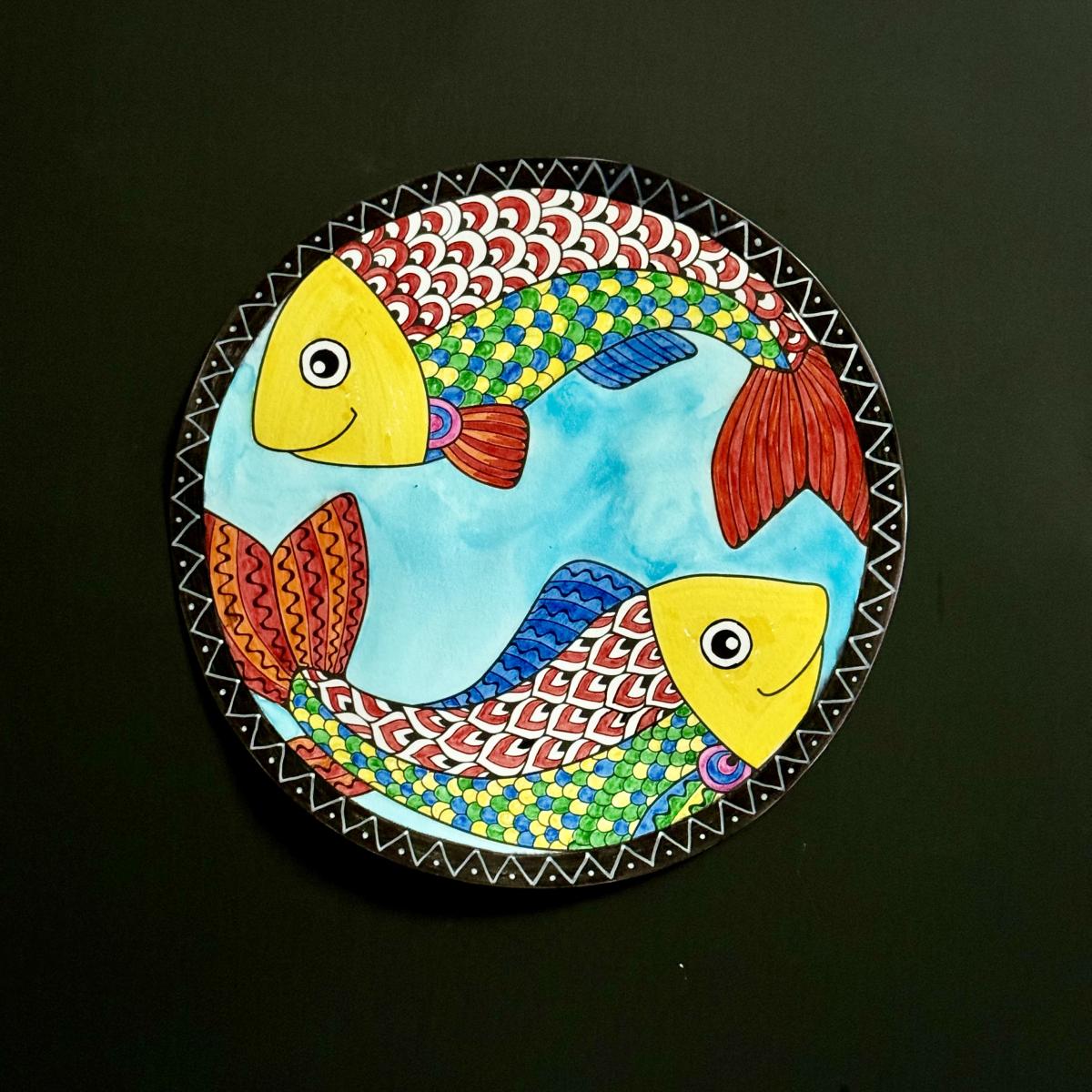 Circle painting of two rainbow fish