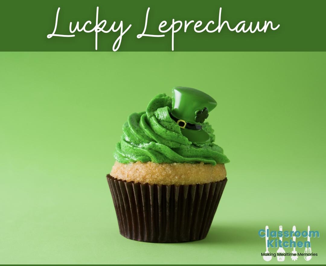 cupcake with green frosting and green top hat decoration