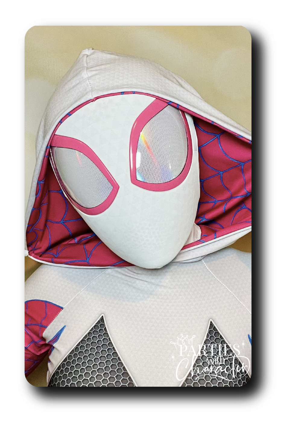 Women in white spider mask with a pink hood