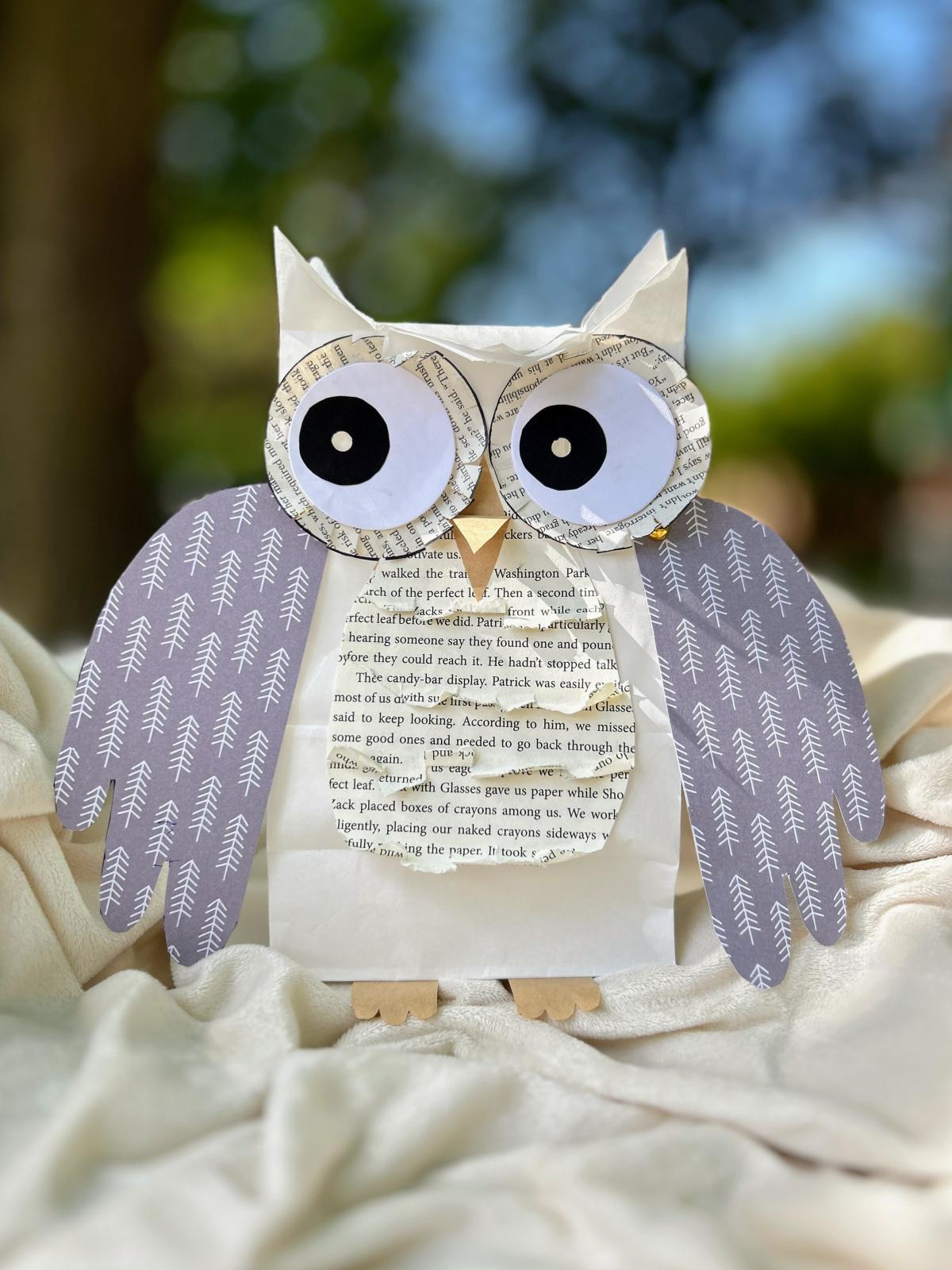 Owl made out of white paper bag and gray paper for wings