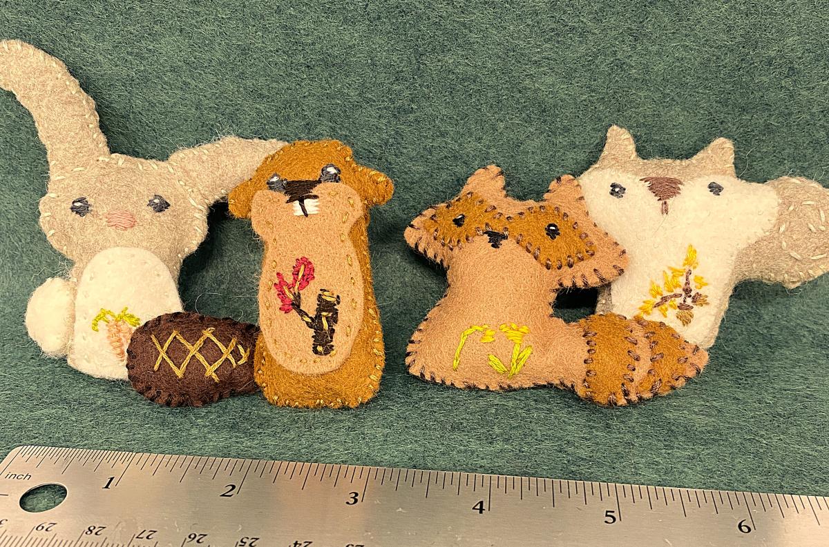 Four hand-sewn felt animals