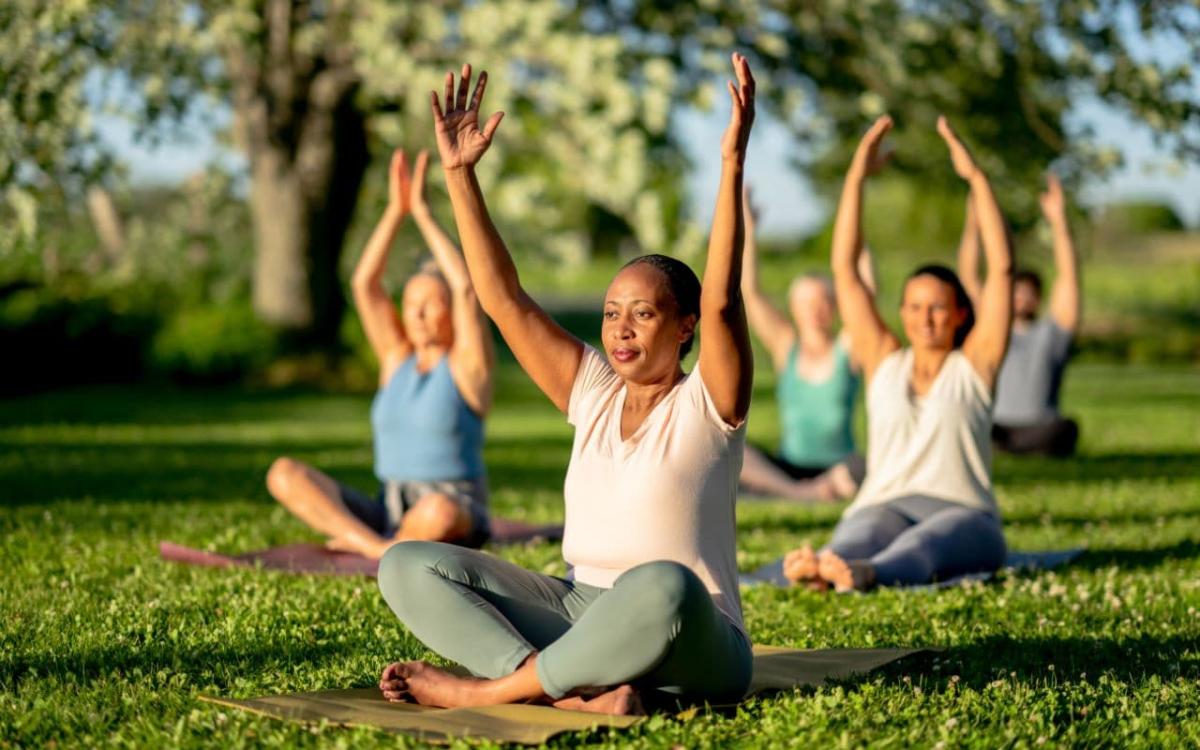 Women doing yoga outside