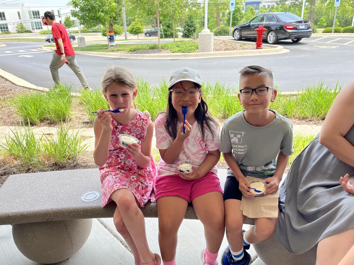 Three kids eating custard from Culver's